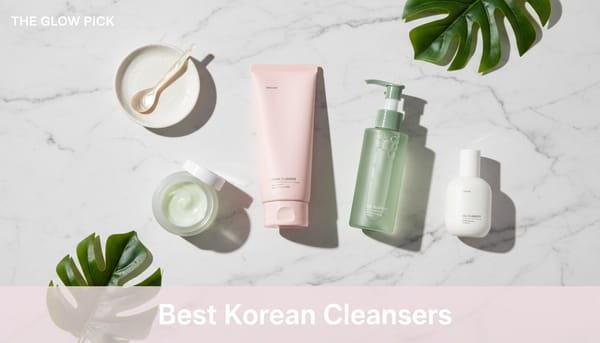 Best Korean cleansers flatlay featuring foam cleansers, oil cleansing balms and gel cleansers on marble surface